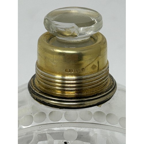 190 - An engraved glass perfume bottle, with gilt metal cap, 12 cm high