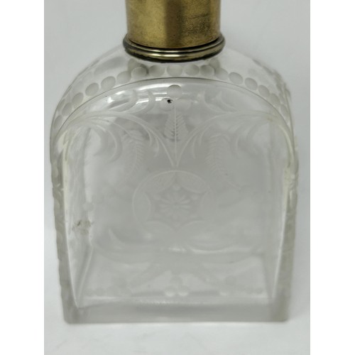 190 - An engraved glass perfume bottle, with gilt metal cap, 12 cm high