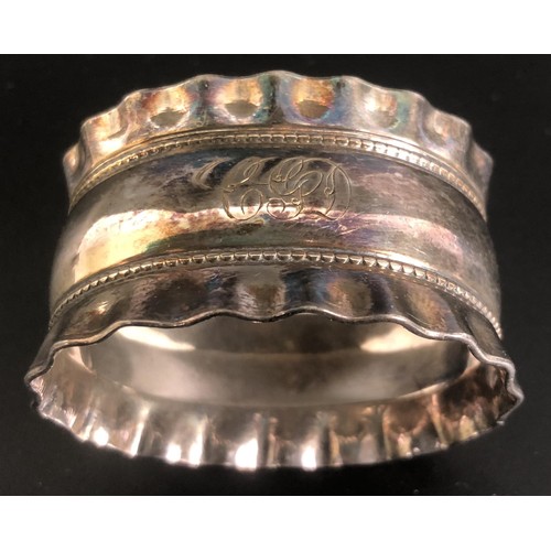 197 - Assorted napkin rings and a sifter spoon, various dates and marks, 5.9 ozt (8)