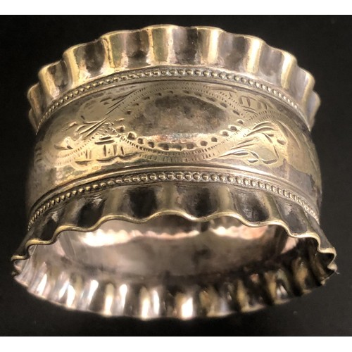 197 - Assorted napkin rings and a sifter spoon, various dates and marks, 5.9 ozt (8)