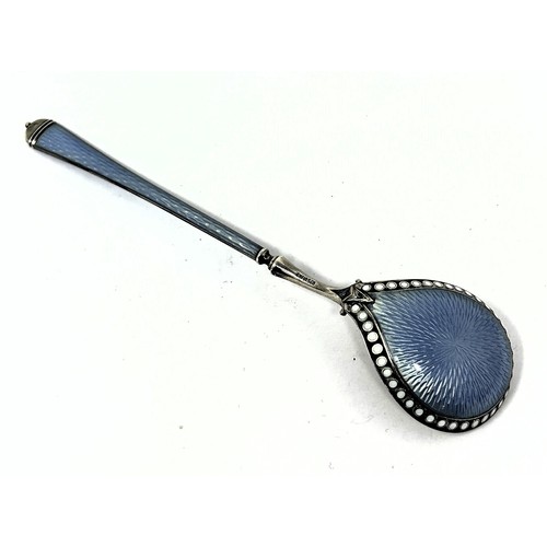 217 - A Continental silver coloured metal, blue and white enamel spoon