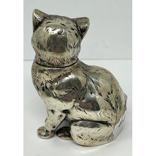 219 - A novelty silver jar and cover, in the form of a cat, 7 cm high, and a small silver chick, 2 cm high... 