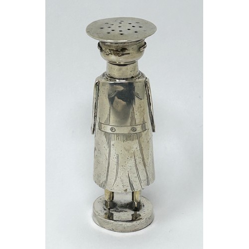 222 - An Edward VII novelty silver pepper, in the form of a chauffeur, Chester 1906, all in 51 g