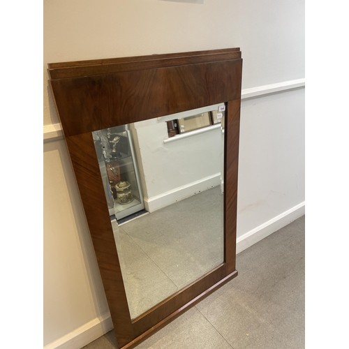 1184 - An Art Deco wall mirror, in a walnut frame, 123 x 75 cm