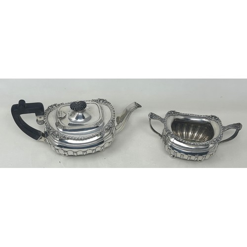 19 - A George V silver bachelor teapot with an ebonised handle, and matching sugar bowl, London 1909, all... 