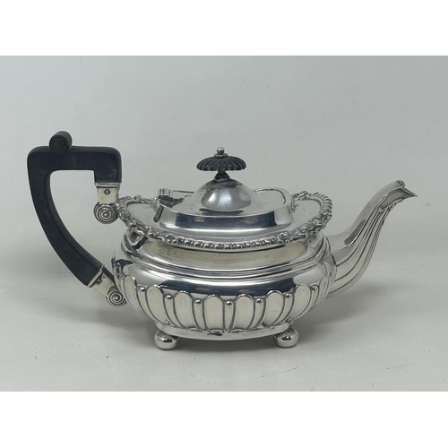 19 - A George V silver bachelor teapot with an ebonised handle, and matching sugar bowl, London 1909, all... 