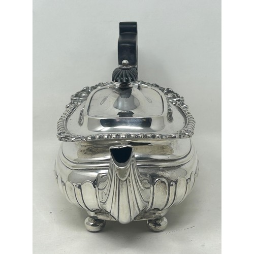 19 - A George V silver bachelor teapot with an ebonised handle, and matching sugar bowl, London 1909, all... 