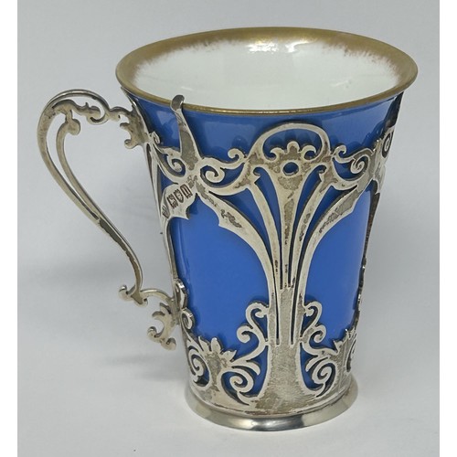 44 - A set of six porcelain and silver mounted coffee cans, London 1906