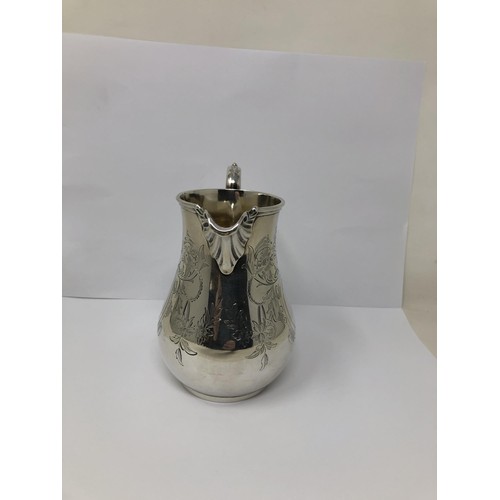 73 - A Victorian silver cream jug, by Charles Stuart Harris, London 1869, 8.7 ozt