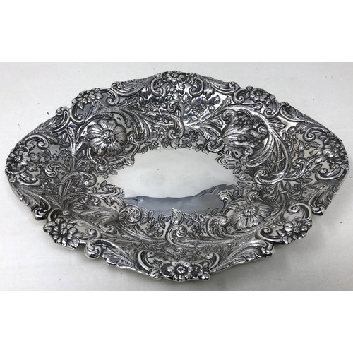 68 - A Victorian silver oval bowl, embossed flowers, London 1886, 17.8 ozt, cased