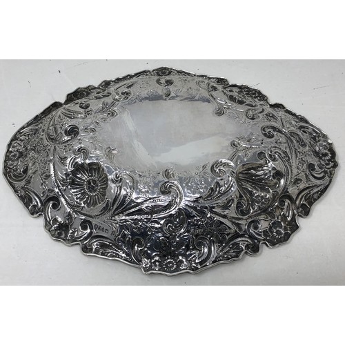 68 - A Victorian silver oval bowl, embossed flowers, London 1886, 17.8 ozt, cased