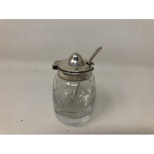 70 - A pair of silver salts, a pepper pot, two napkin rings, a fork and spoon 6.6 ozt, a silver backed mi... 