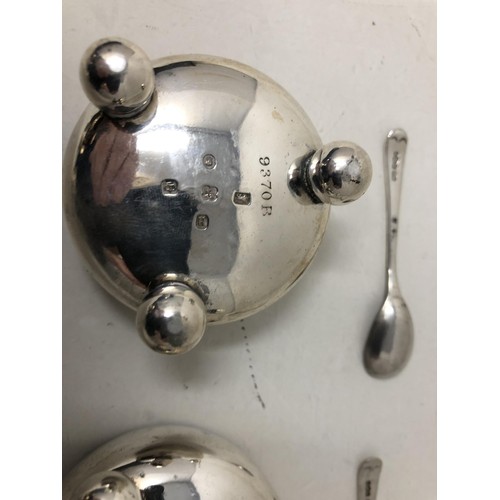 70 - A pair of silver salts, a pepper pot, two napkin rings, a fork and spoon 6.6 ozt, a silver backed mi... 