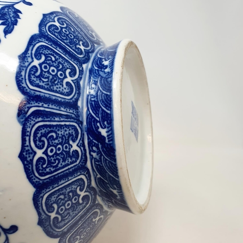 1085 - A Chinese blue and white bottle vase, decorated flowers in underglaze blue, bears a Qianlong mark, 3... 