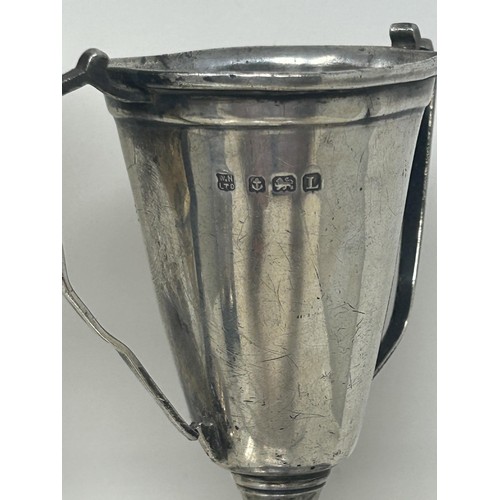 121 - A George V silver goblet, a trophy cup, 2.1 ozt, assorted napkin rings and other items (box)