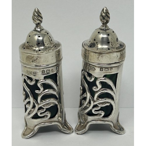 187 - An Art Nouveau silver three piece cruet set, Birmingham 1907