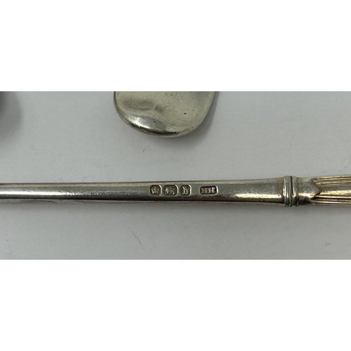 199 - A George III silver cheese scoop, an Old English pattern ladle, an Old English pattern spoon, and a ... 