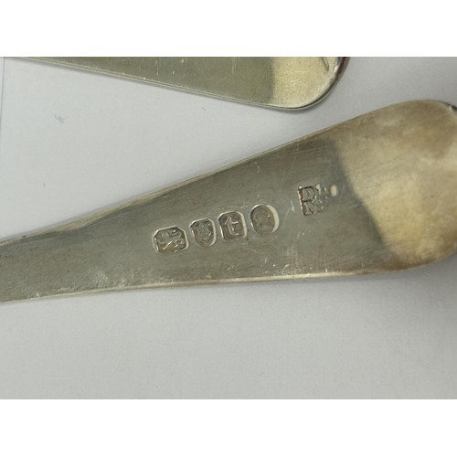 199 - A George III silver cheese scoop, an Old English pattern ladle, an Old English pattern spoon, and a ... 