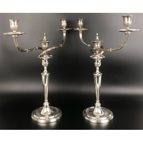 262 - A pair of George III silver two branch candelabra, London 1788, 85.4 ozt (2)