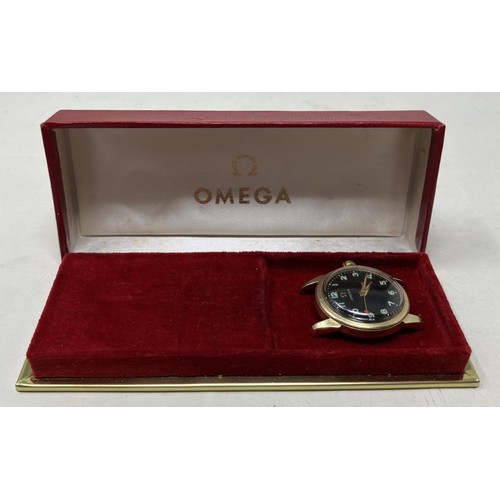 349 - A gentleman's 14ct gold Omega wristwatch, lacking strap, in an associated Omega box