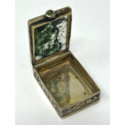 413 - A Continental gilt silver coloured metal and moss agate type green stone box, 3 cm wide