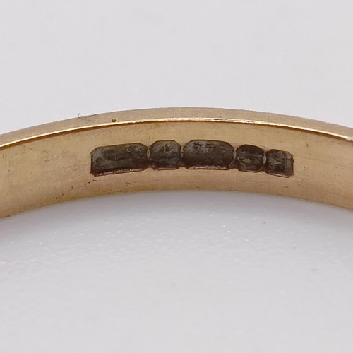 416 - A 9ct gold, red stone and diamond ring (size M), a half eternity ring (size M 1/2), a wedding band (... 