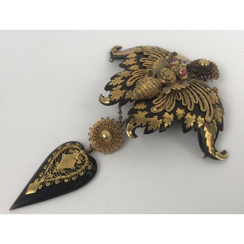 420 - A large Victorian yellow coloured metal and tortoiseshell brooch, in the form of a butterfly, in a l... 