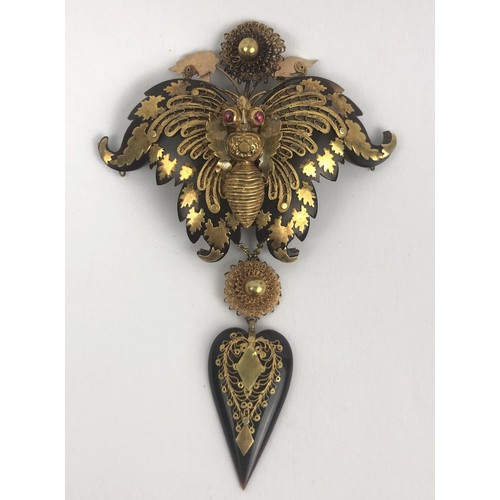 420 - A large Victorian yellow coloured metal and tortoiseshell brooch, in the form of a butterfly, in a l... 