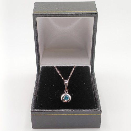 422 - A 14ct white gold and blue diamond pendant, with a silver chain, boxed, RBC diamond 0.20ct