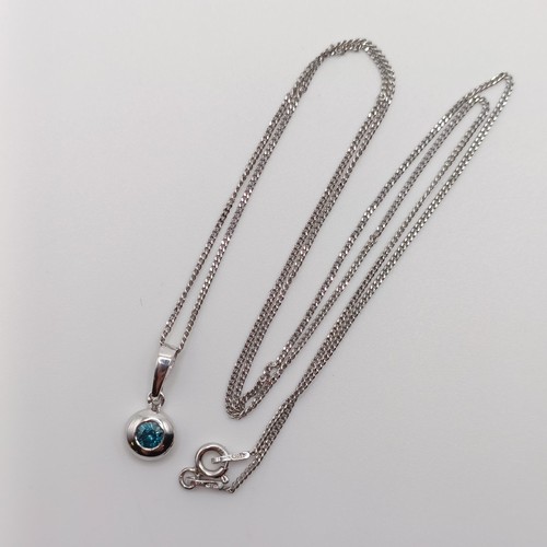 422 - A 14ct white gold and blue diamond pendant, with a silver chain, boxed, RBC diamond 0.20ct