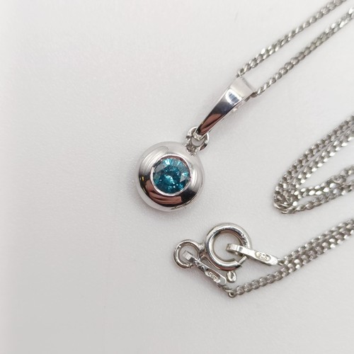 422 - A 14ct white gold and blue diamond pendant, with a silver chain, boxed, RBC diamond 0.20ct