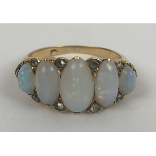 426 - A gold and five stone opal ring, ring size N