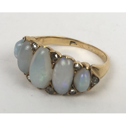 426 - A gold and five stone opal ring, ring size N