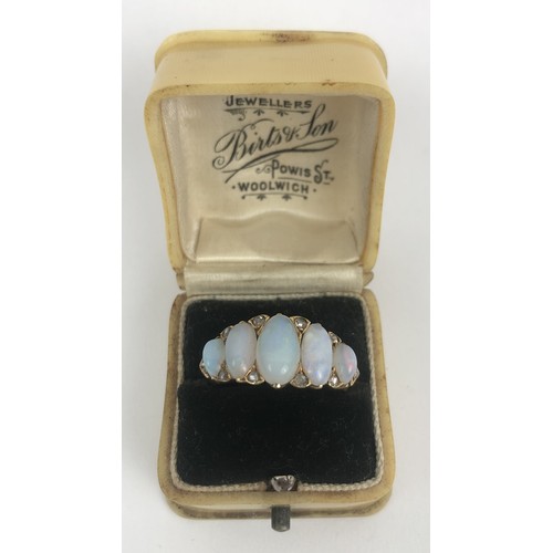 426 - A gold and five stone opal ring, ring size N