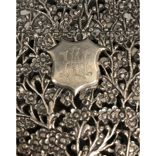 293 - A Chinese silver coloured metal visiting card case, initialled, pierced prunus decoration, 11.5 cm