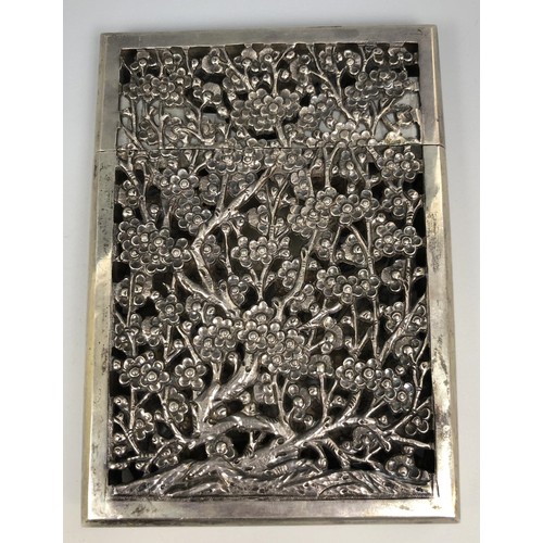 293 - A Chinese silver coloured metal visiting card case, initialled, pierced prunus decoration, 11.5 cm