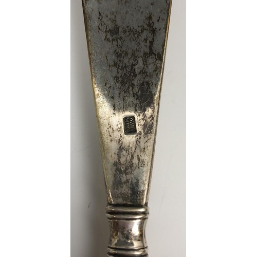 295 - A Chinese silver coloured metal shoe horn, the handle decorated a dragon chasing a flaming pearl, 24... 