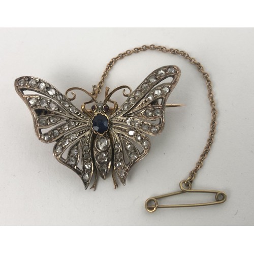 429 - A late 19th/early 20th century diamond, sapphire and red stone brooch, in the form of a butterfly