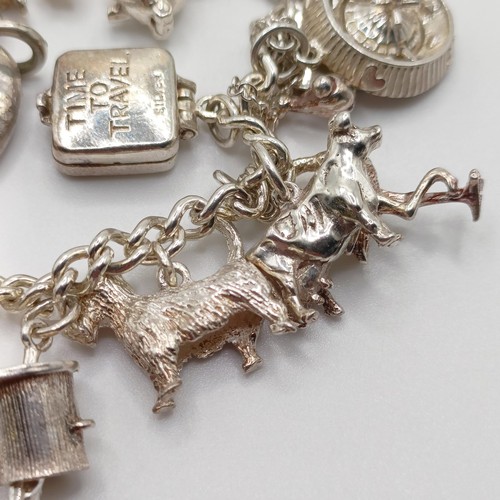 430 - A silver charm bracelet