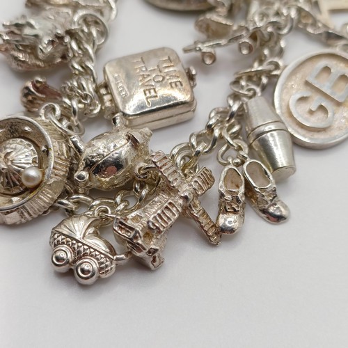 430 - A silver charm bracelet