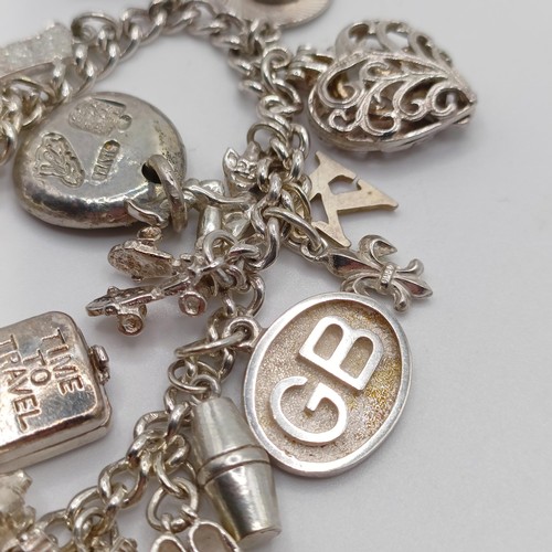 430 - A silver charm bracelet