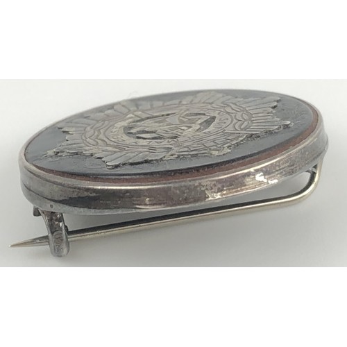 428 - A silver and tortoiseshell regimental sweetheart brooch, in a vintage jewellery box, and a Scottish ... 