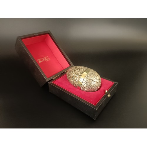 83 - A silver gilt Easter egg, by Stuart Devlin, No 101, cased with receipt, 5.75 ozt