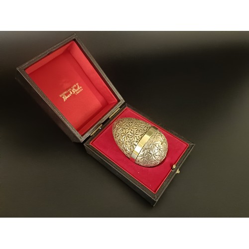 83 - A silver gilt Easter egg, by Stuart Devlin, No 101, cased with receipt, 5.75 ozt