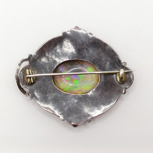 409 - An Arts and Crafts silver coloured metal, opal, green stone and enamel brooch, by Jean Bassett  Prov... 