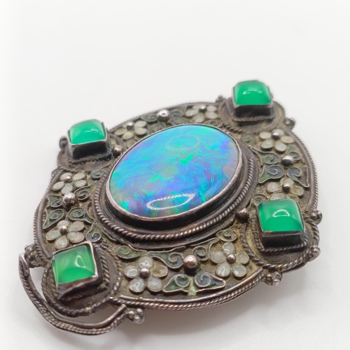 409 - An Arts and Crafts silver coloured metal, opal, green stone and enamel brooch, by Jean Bassett  Prov... 