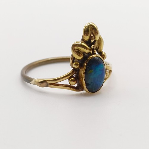 408 - An Arts and Crafts yellow coloured metal and opal ring, by Jean Bassett, size J 1/2Provenance:  Desc... 