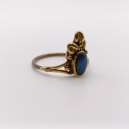 408 - An Arts and Crafts yellow coloured metal and opal ring, by Jean Bassett, size J 1/2Provenance:  Desc... 