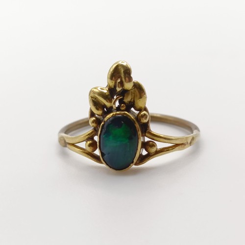 408 - An Arts and Crafts yellow coloured metal and opal ring, by Jean Bassett, size J 1/2Provenance:  Desc... 