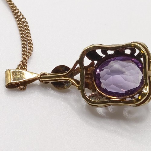 437 - An amethyst pendant, on a 8ct gold chain